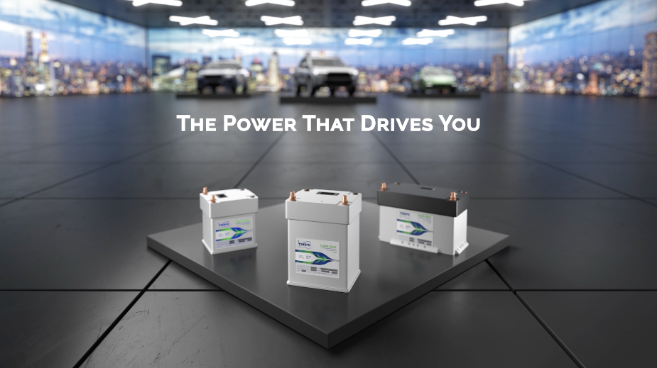 Three TSAPA batteries displayed in a CGI showroom with vehicles in the background.